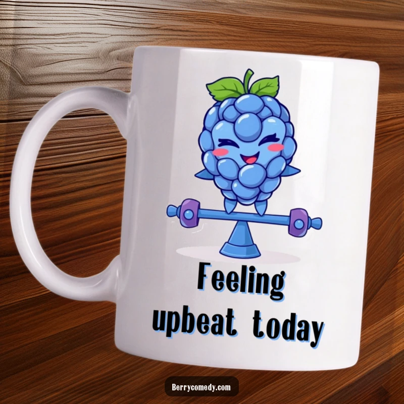 Funny mug showing a smiling blue raspberry character with a mischievous wink, comically balancing precariously on a teeter-totter.