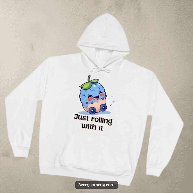 Funny hoodie featuring a joyful blueberry character in motion, rolling downhill with a spark of playful mischief in its eyes.