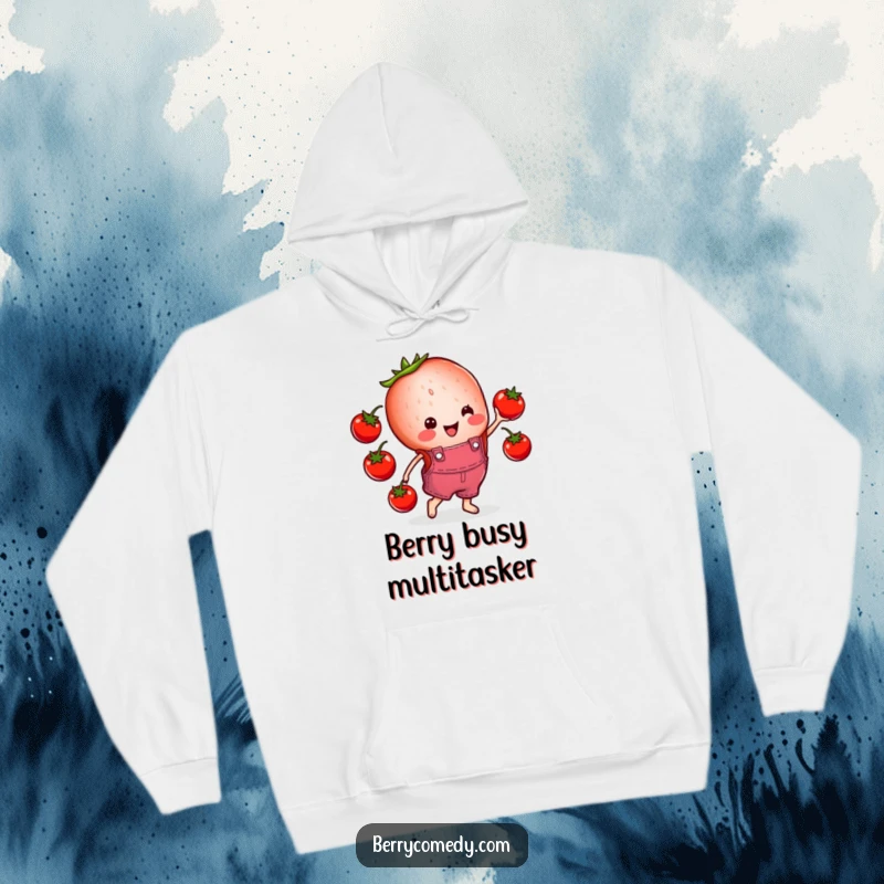 Funny hoodie art of a cheerful strawberry slice in overalls playfully juggling cherry tomatoes, exuding happiness and lightheartedness.
