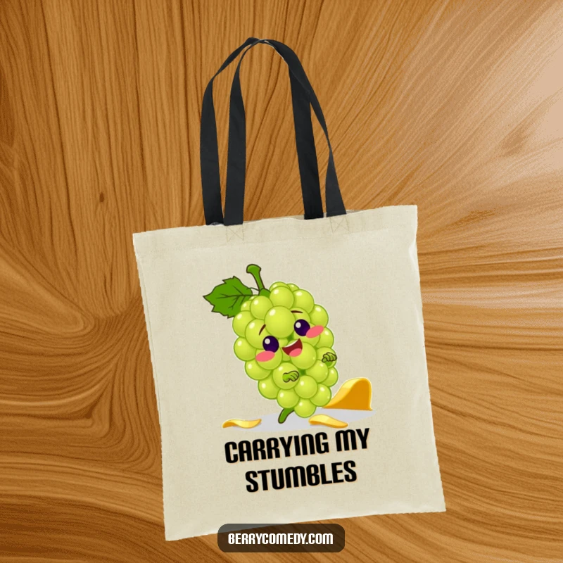 Funny tote bag with a jolly green grape character comically tripping over a banana peel, perfect for carrying groceries with a smile.
